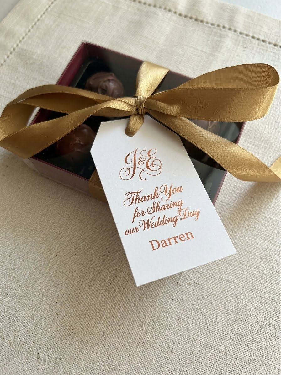 Real Lefevre Chocolate wedding favour with gold ribbon and personalised tag